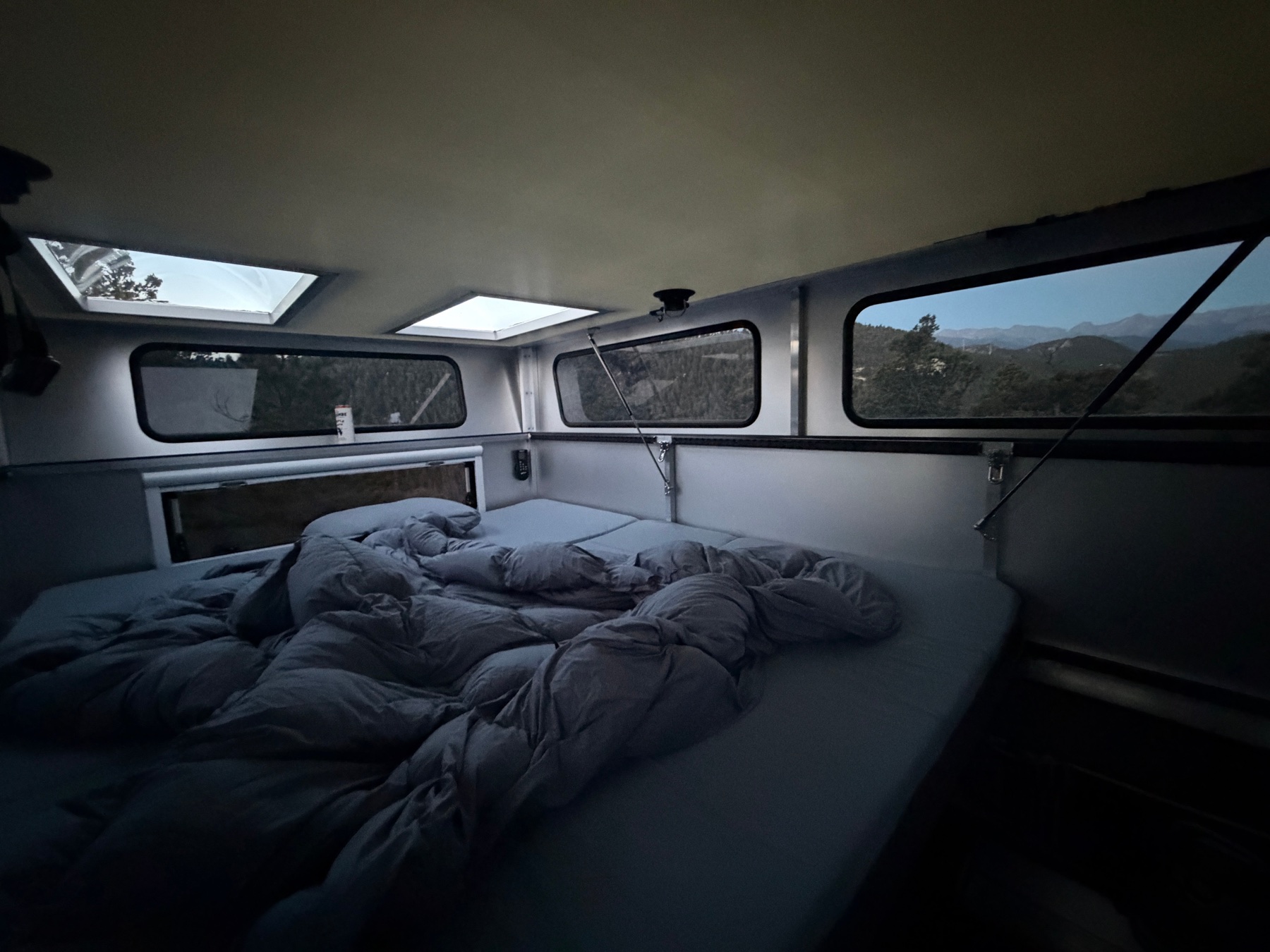 Interior of the Radica STARGATE showing the master bed, panoramic side windows and roof skylights